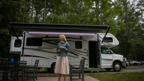 Washington Post travel writer Andrea Sachs stands outside of her rented RV Saturday, September 19, 2020 at a KOA campground in Fredericksburg, Virginia.