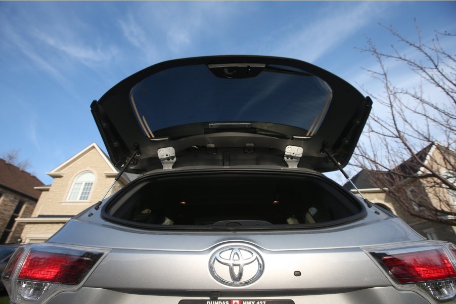 A Toyota Highlander with the back window of the truck opened up