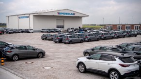 Cars are parked in front of the terminal for shipping used cars from Europe to Africa