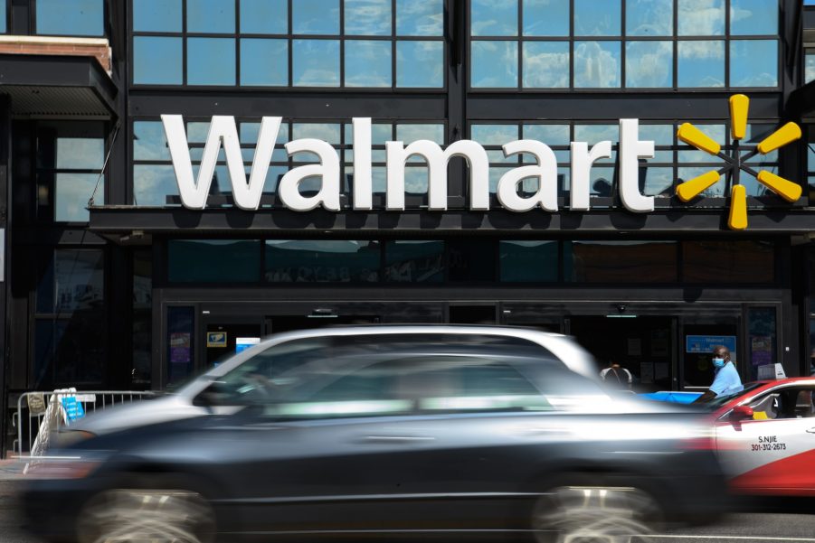 Cars drive past a Walmart store in Washington, DC