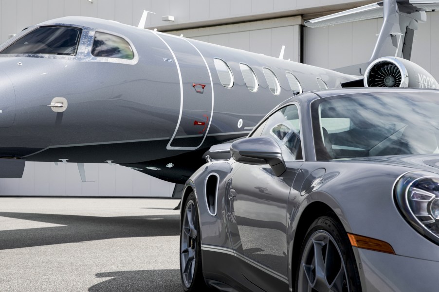 Porsche 911 Turbo S shares two-tone paintwork and elegant details with an Embraer jet.