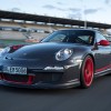 A gray 2010 Porsche 911 GT3 RS on a track