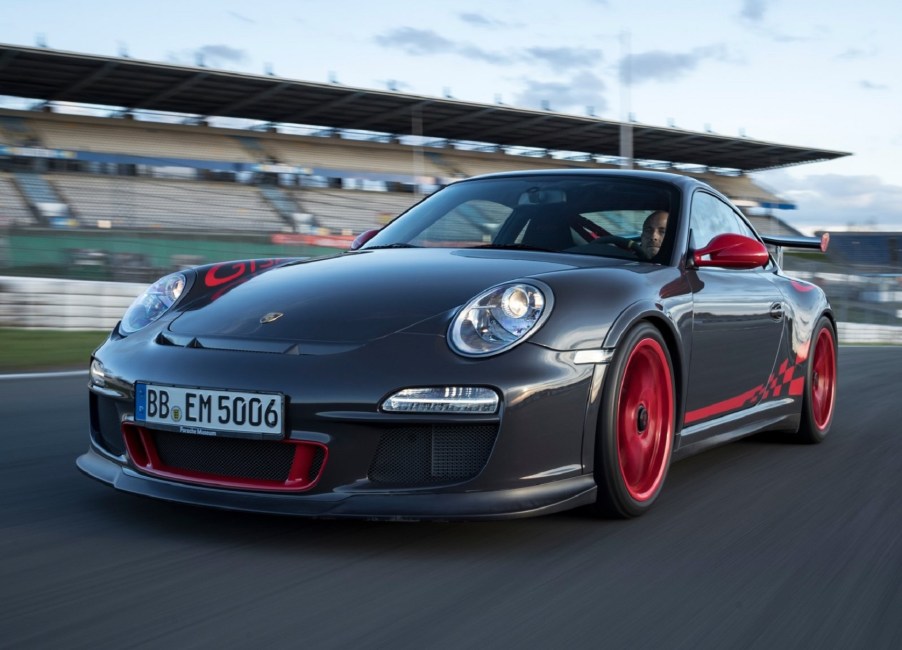 A gray 2010 Porsche 911 GT3 RS on a track