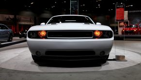 A Dodge Challenger on display at an auto show in 2013