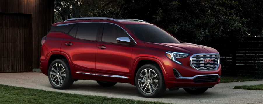 A red 2019 GMC Terrain Denali parked in the driveway.