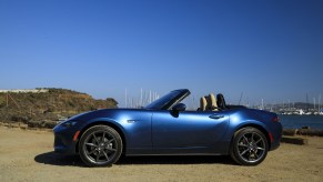 A blue 2019 Mazda MX-5 Miata parked on display