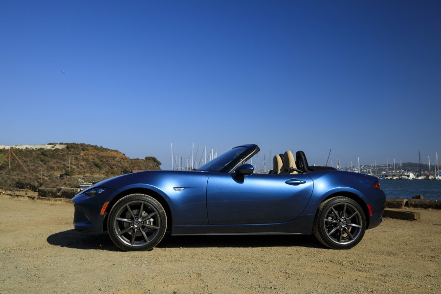 A blue 2019 Mazda MX-5 Miata parked on display