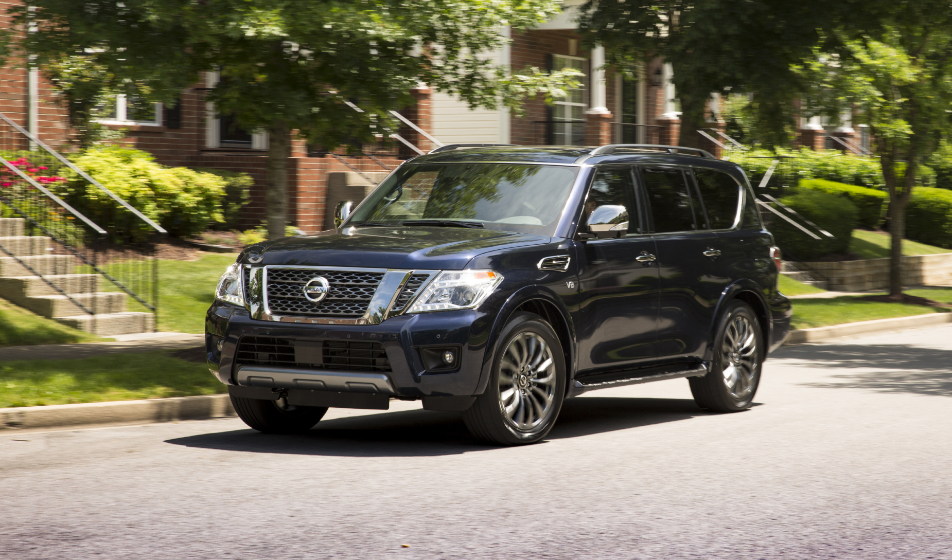 a 2020 Nissan Armada driving in a neighborhood