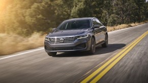 A grey 2020 Volkswagen driving down a highway road