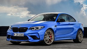 A blue 2021 BMW M2 CS on a racetrack