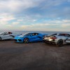 White, blue, and silver Chevy Corvettes on display