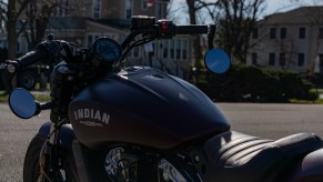 The rear 3/4 view of a 2021 Indian Scout Bobber motorcycle's handlebars and gauge