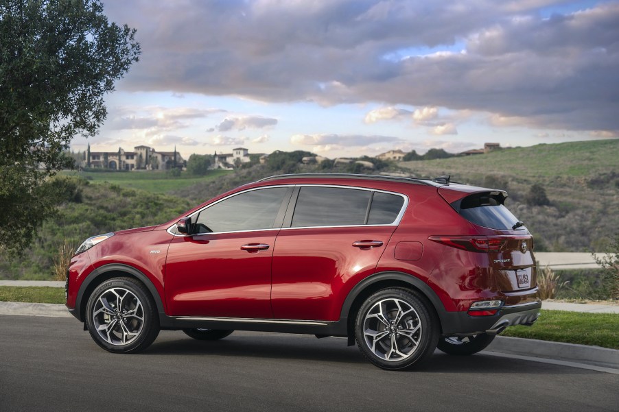 2021 Kia Sportage driving down a road