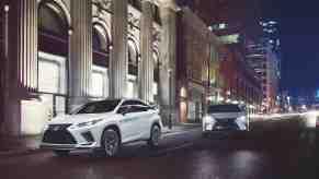 A white 2021 Lexus RX 450h on a city street