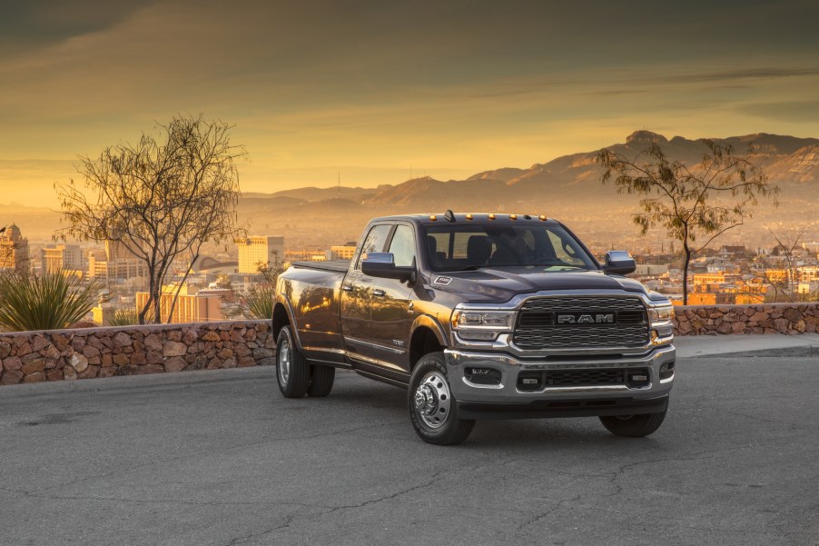 A 2021 Ram 3500 parked on display with trees in the background