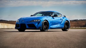 A bright-blue 2021 Toyota GR Supra A91 Edition is parked on a racetrack