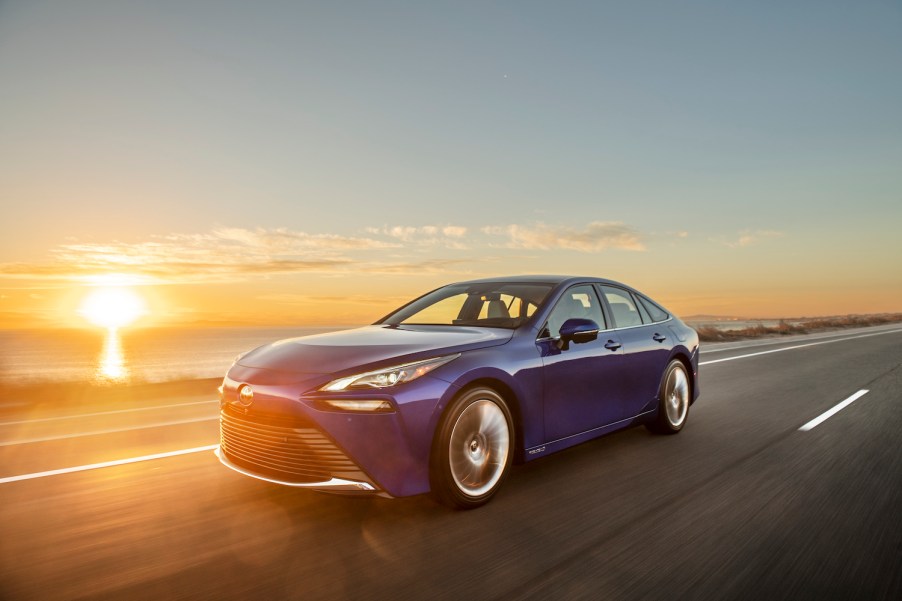 2021 Toyota Mirai driving during a sunset