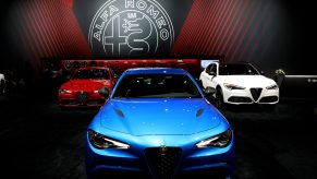 2019 Alfa Romeo Giulia (red and blue) and Alfa Romeo Stelvio are on display at the 111th Annual Chicago Auto Show