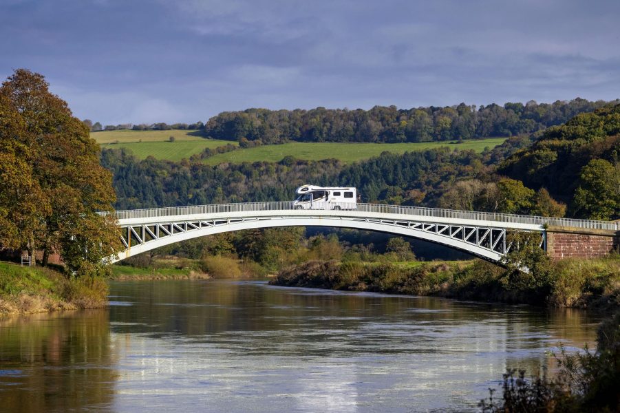 A camper van travels from the England to Wales over Bigsweir Bridge