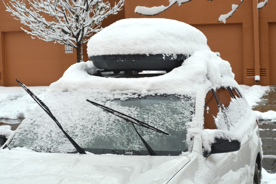 A car parked outside covered in snow