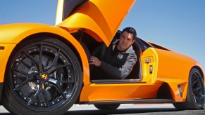 Black HRE aftermarket wheels on an orange Lamborghini