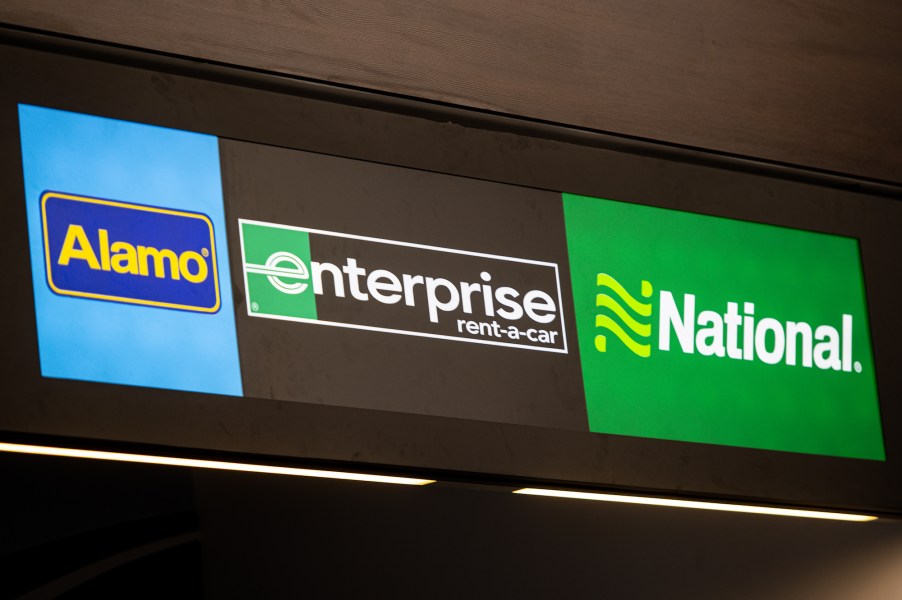 Alamo, Enterprise, and National car rental agency signs at Gdansk Lech Walesa Airport