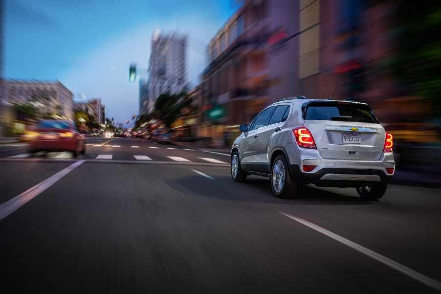 A silver 2020 Chevy Trax Premier travels on a city street