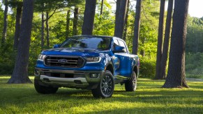 A blue 2020-2021 Ford Ranger parked in the woods