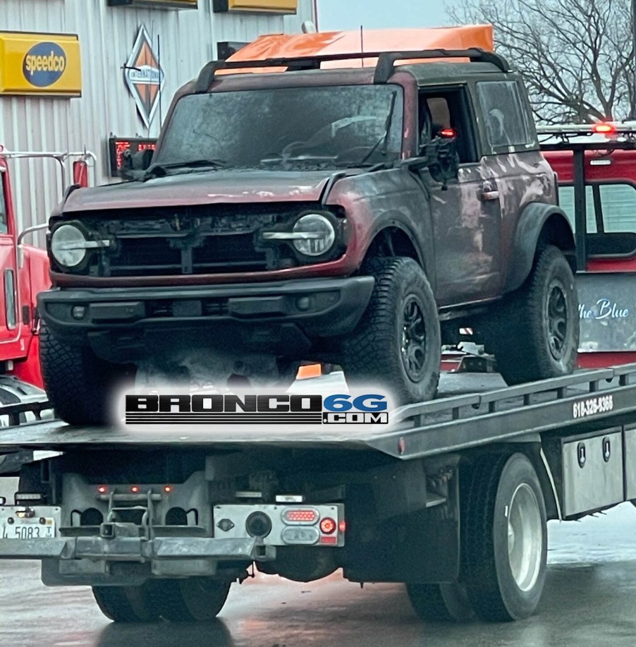 An image of a 2021 Ford Bronco affected by a fire in a transport trailer.