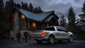 A silver 2021 Ford F-150 Platinum parked in front of a country house