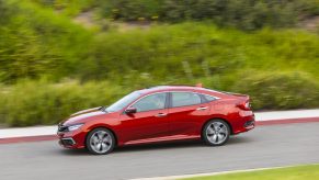 A red 2021 Honda Civic on the track.