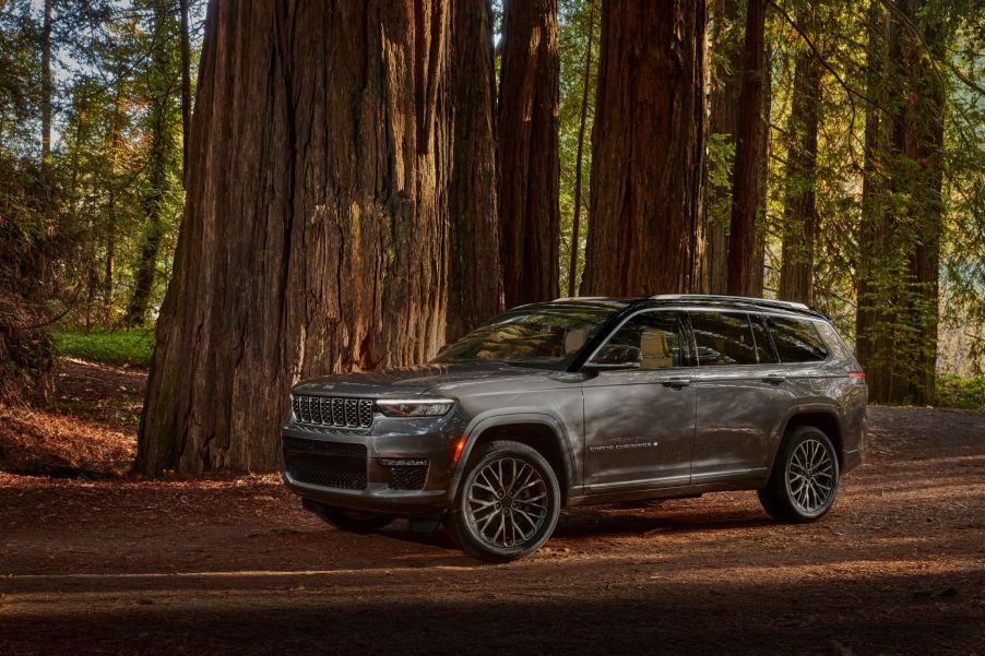 A gray 2021 Jeep Grand Cherokee L Summit Reserve in a forest