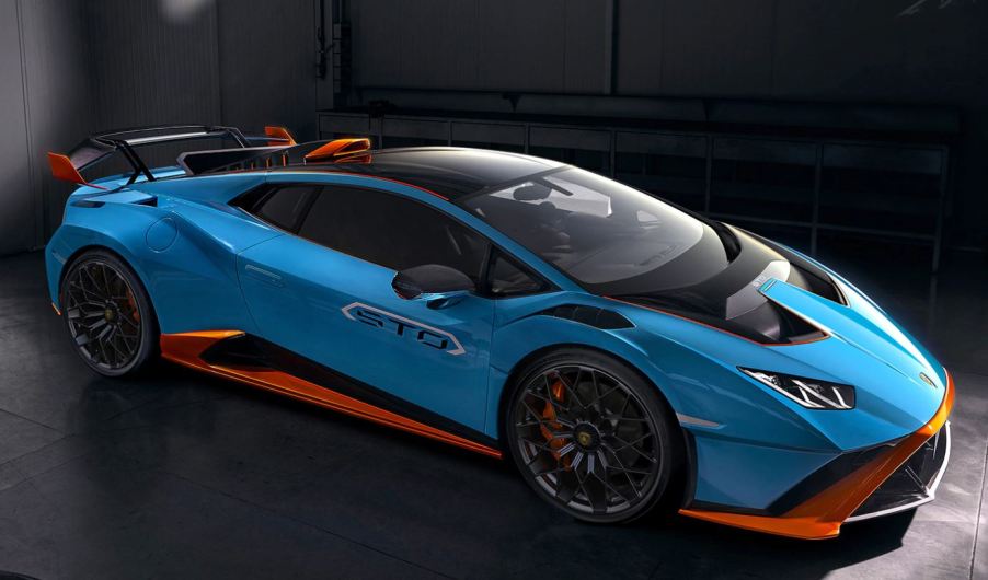 A view of the front passenger side quarter of a blue and orange 2021 Lamborghini Huracan STO.