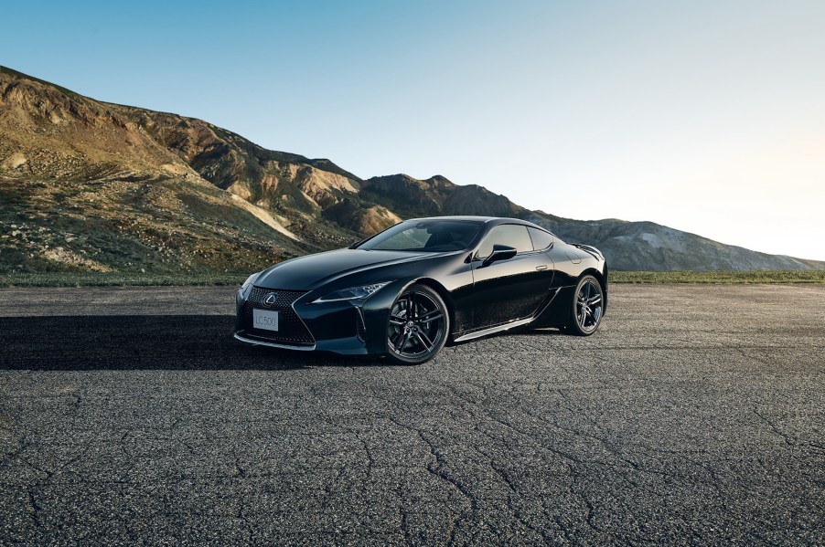 The all-black 2021 Lexus LC 500 Inspiration Series parked on pavement in front of mountains