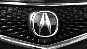 The Acura logo seen on the front grille of an MDX