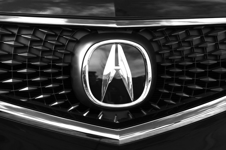 The Acura logo seen on the front grille of an MDX