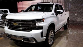 A white 2020 Chevy Silverado on display at an auto show