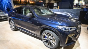 A BMW X6 on display at an auto show