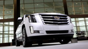 A Cadillac Escalade on display at an auto show