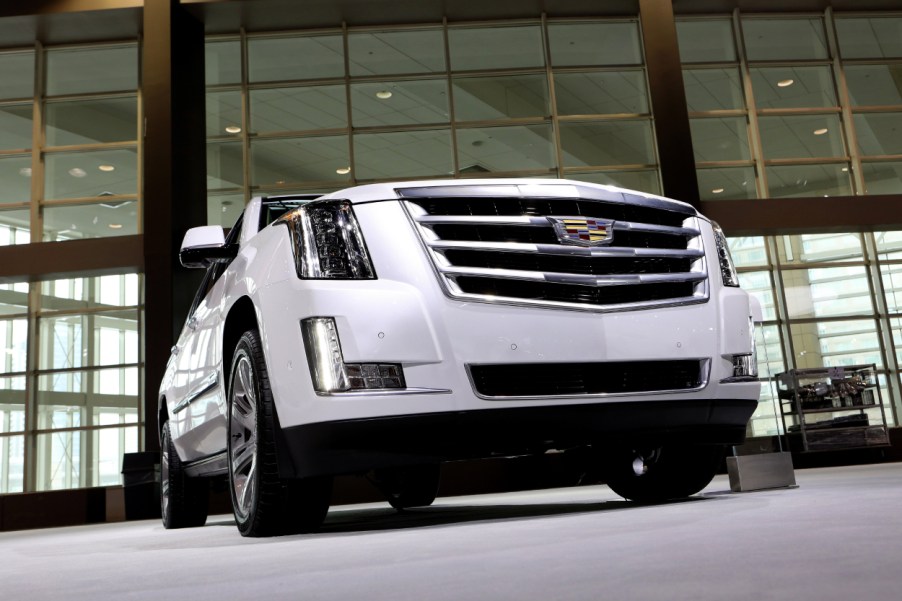 A Cadillac Escalade on display at an auto show