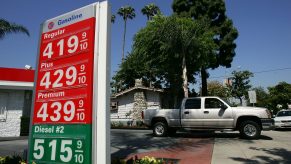 A diesel truck pulling out of a gas station