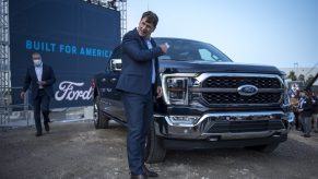 Ford CEO Jim Farley takes off his mask at the Ford Built for America event at Ford’s Dearborn Truck Plant on September 17, 2020 in Dearborn, Michigan. Ford held the event to showcase its new advertising campaign, the start of production for the new F-150 pickup truck and the future of the Dearborn Truck Plant