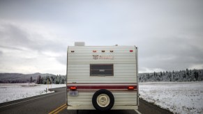 RV driving down a snow road