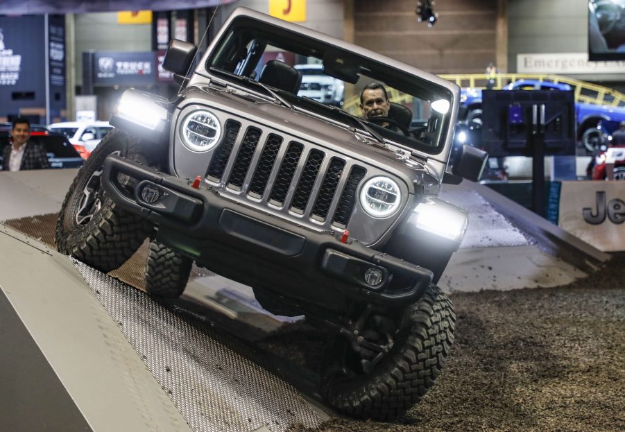 A staff member demonstrates a 2021 Jeep Gladiator at the 2020 Chicago Auto Show Media Preview