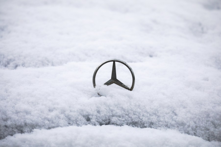 Mercedes Benz car emblem is covered with snow in Krakow, Poland