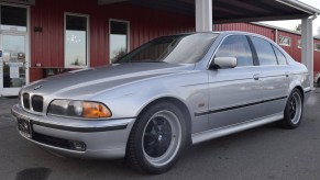 A silver modified 1997 BMW 540i M-Sport