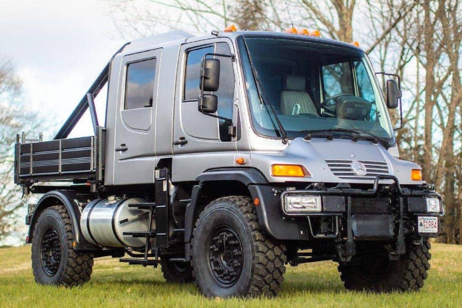 A modified silver 2004 Mercedes Unimog U500