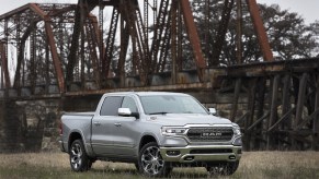 An image of a Ram 1500 parked outside on a field.