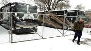 An RV dealership owner shows off his display models