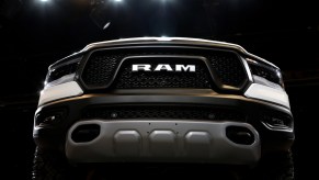 The front grille of a Ram 2500 on display at an auto show